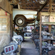 The old office at Old Car City USA. Stacks of car parts are left behind on the shelves from the site’s former career as a junkyard. Of particular interest are the old fashioned AM radios and instrument clusters.